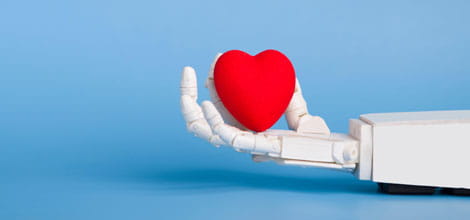 Robot hand holding model heart